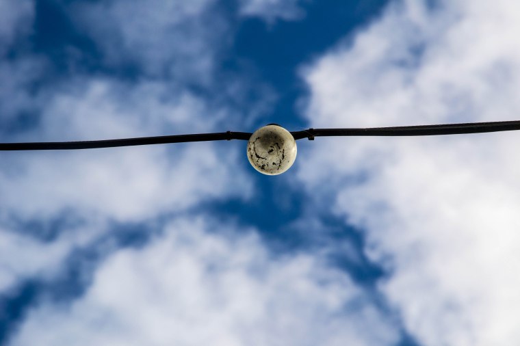 THE MOON IS HELD UP BY WIRE